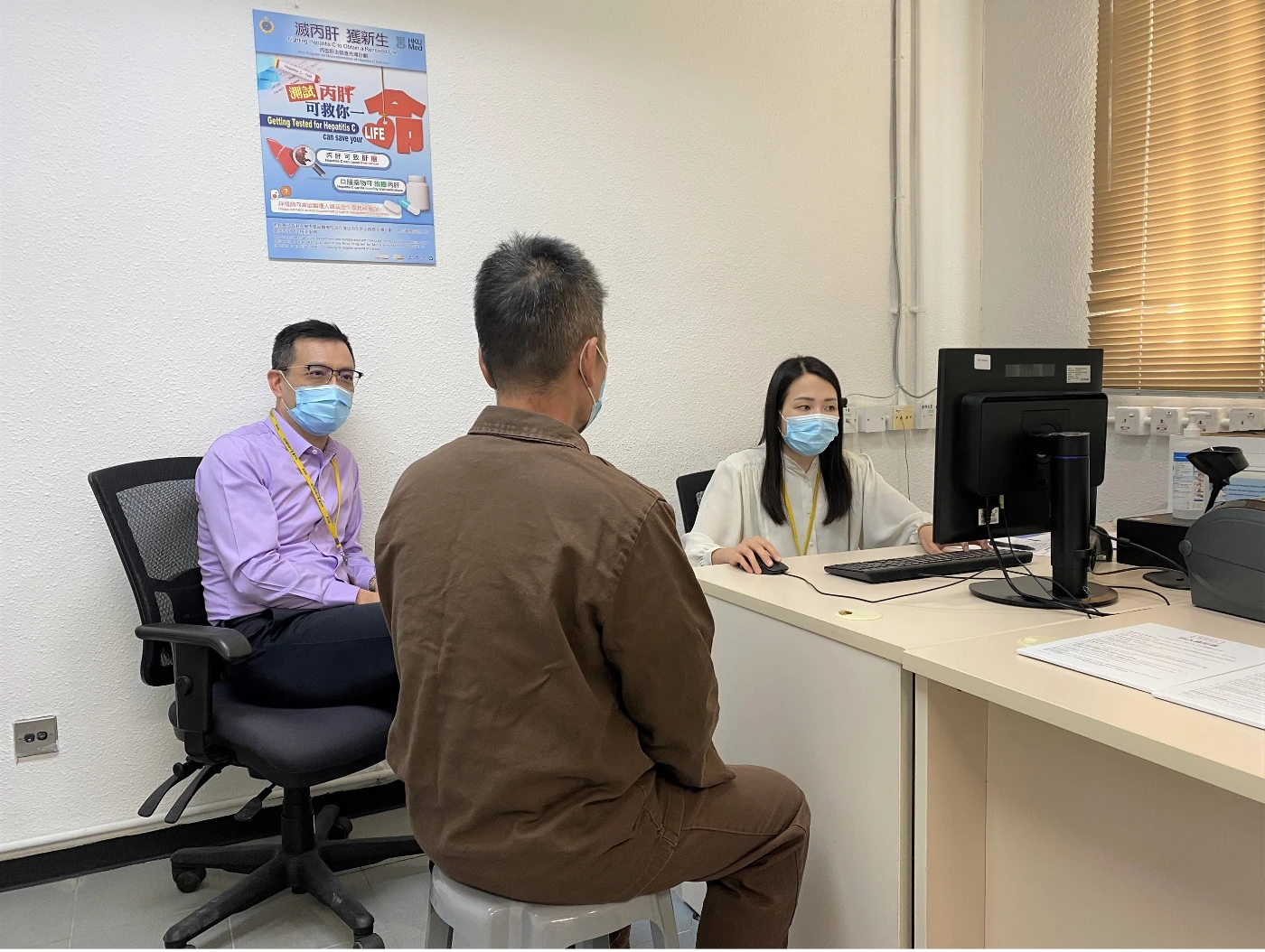 The programme was launched at Stanley Prison, with the research study leaders, Professor Richard Yuen Man-fung (left) and Dr Loey Mak Lung-yi (right), providing a consultation to an individual in custody.