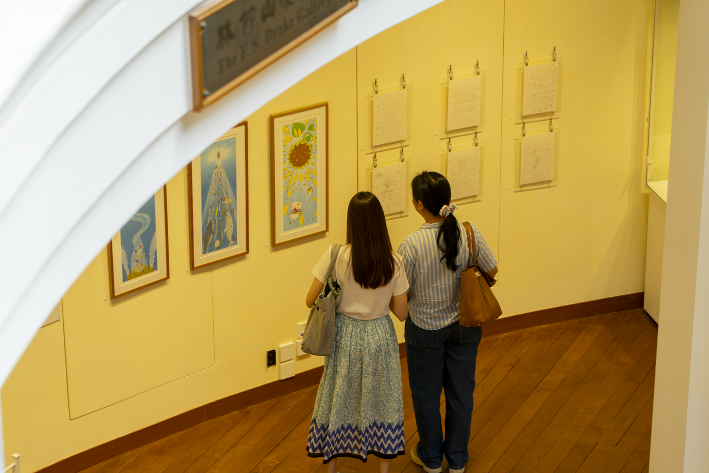 Visitors take in an exhibit at UMAG.