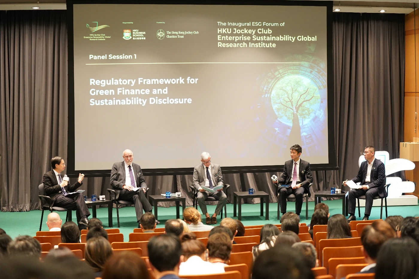 (From second left) Mr. Michael DUIGNAN, Executive Director (Corporate Finance) of Securities and Futures Commission; Mr. Sabino FORNIES-MARTINEZ, Minister Counsellor, Economic and Financial Affairs Section of EU Delegation Beijing; Mr. Kenneth HUI, Executive Director (External) of Hong Kong Monetary Authority; and Dr. Bing LENG, Member of International Sustainability Standards Board, participate in the panel discussion titled “Regulatory Framework for Green Finance and Sustainability Disclosure”, moderated by Professor Jun MA (first left), Professor of Practice of HKU Business School and Chairman and President of Hong Kong Green Finance Association.