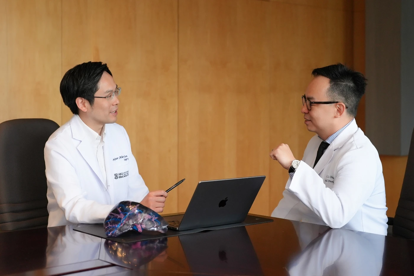 Professor Albert Chan Chi-yan (left) and Dr Chiang Chi-leung collaborate once more to develop the innovative ‘cocktail’ strategy—Locoregional therapy and immunotherapy (LRT-IO) approach. This method features three treatment stages: stereotactic beam radiotherapy (SBRT) with optional transarterial chemoembolisation (TACE), followed by immunotherapy (IO).