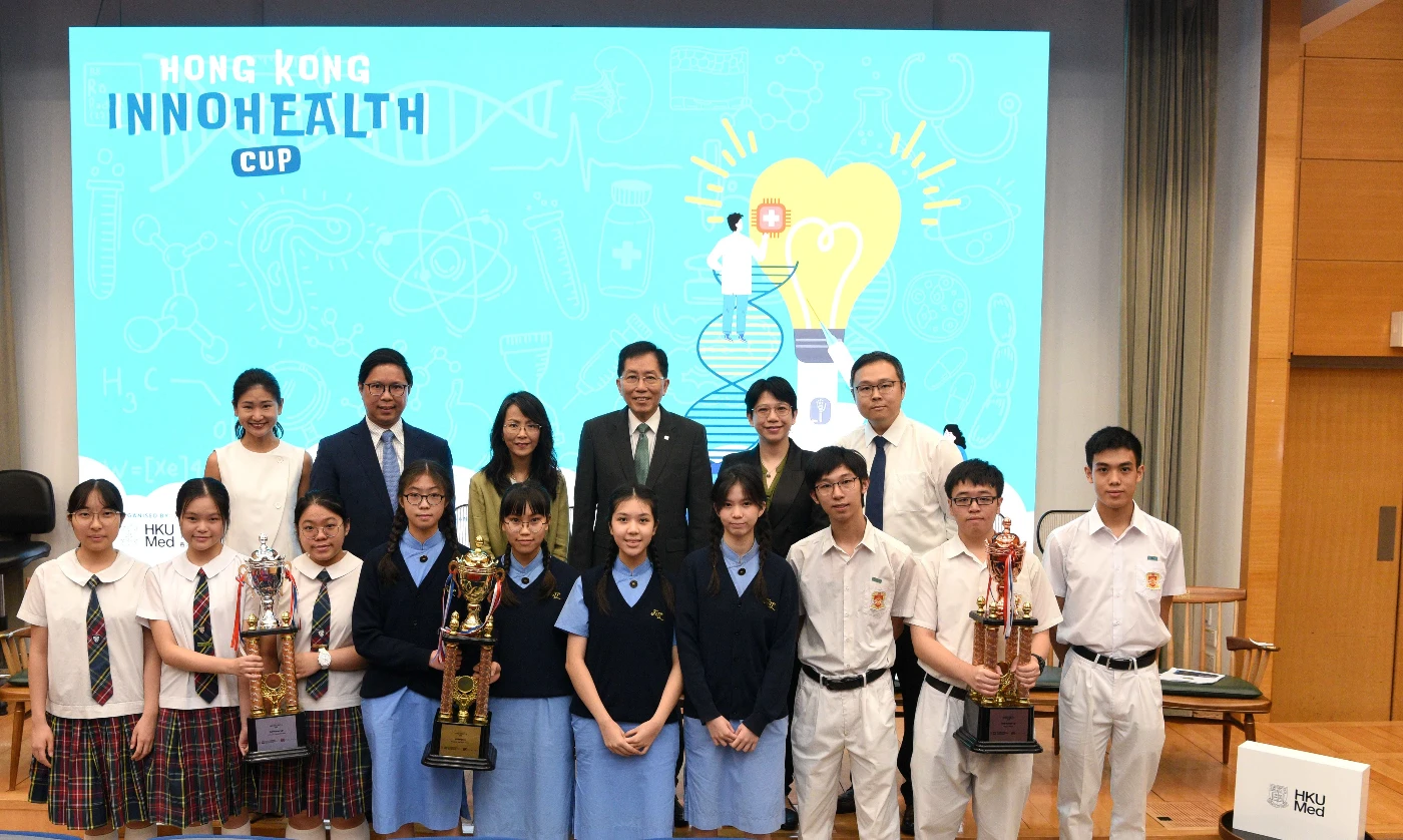 The award-winning teams and secondary school teachers, pose for a photo with representatives from the co-organisers, including competition convenor Professor Chan Ying-shing (back row, third from right), Principal Lee Yi-ying, Chairman of the Hong Kong Subsidized Secondary Schools Council (back row, third from left), and two representatives from the School of Biomedical Sciences at HKUMed, Professor Joshua Ho Wing-kei (back row, second from left) and Professor Cora Lai Sau-wan (back row, second from right).