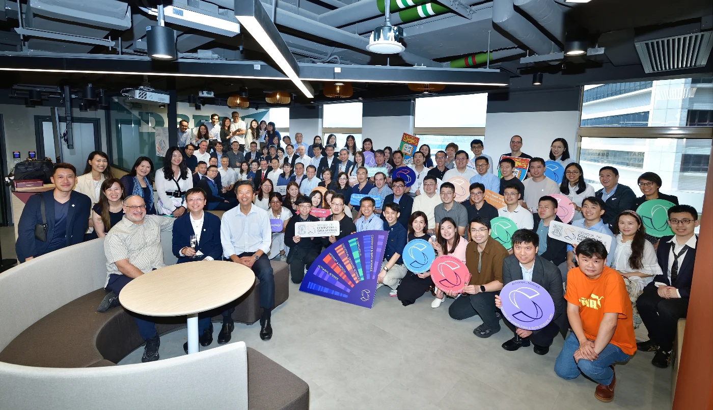 Faculty members and staff gather to celebrate the establishment of the School of Computing and Data Science.