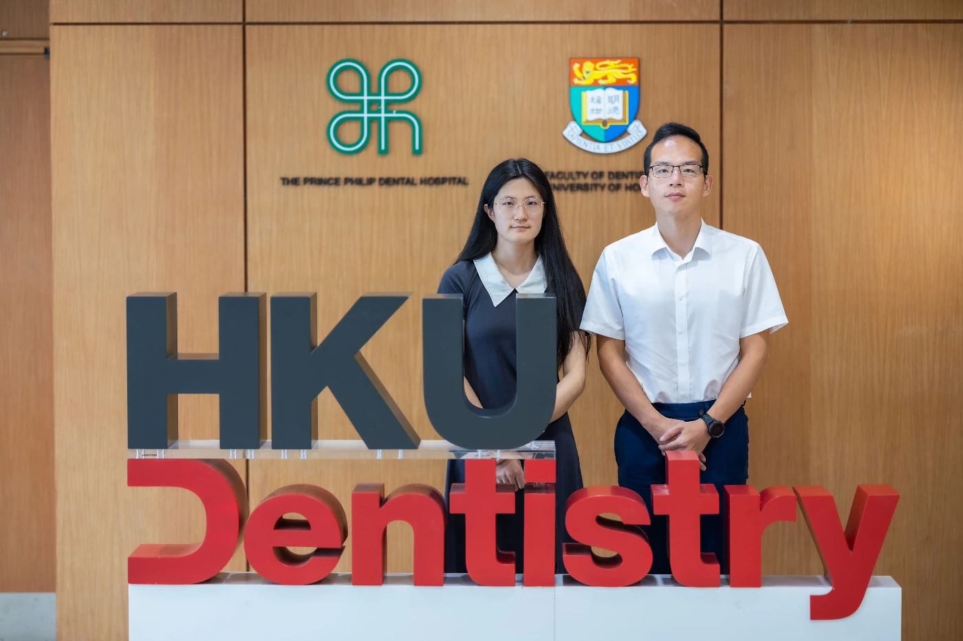 (From right) Professor Shi Huang and PhD student Yufeng Zhang