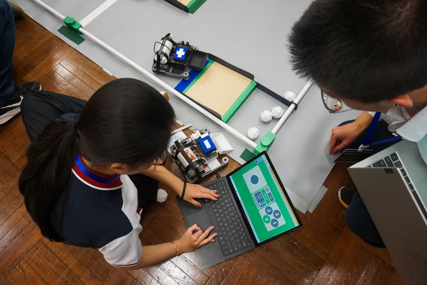 Students competing during the robotics challenge session
