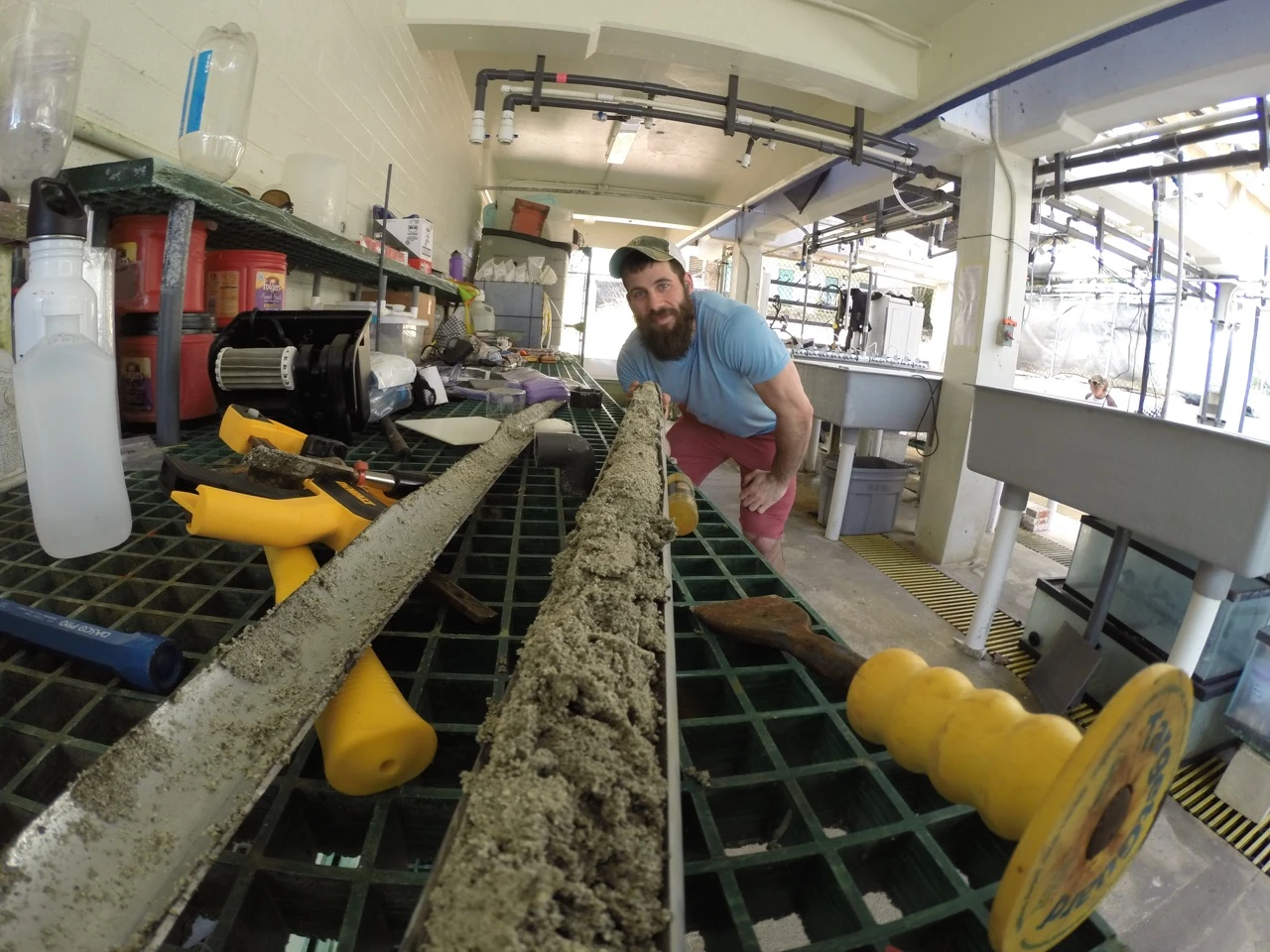 Cybulski looking down the “fossil time machine” containing coral fossils for analysis.
 (Photo credit: Dr Kiho Kim)